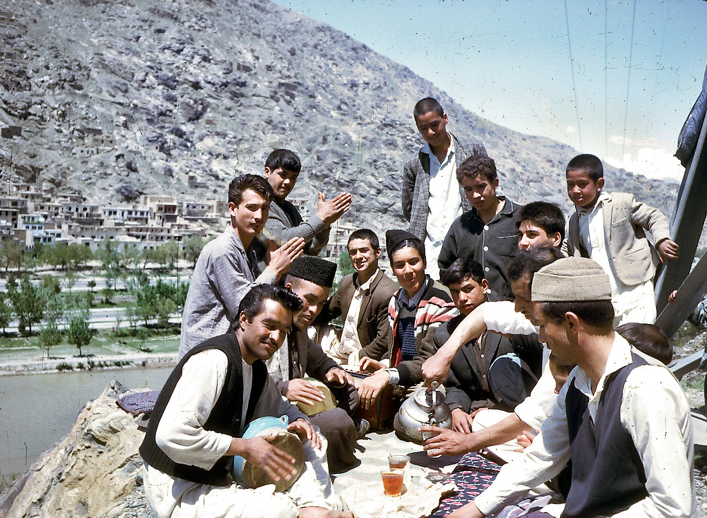 "A group of young Afghans share tea and music."