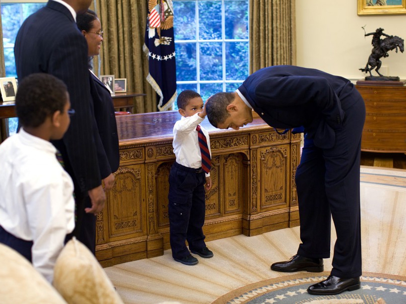 May 8, 2009 “A temporary White House staffer, Carlton Philadelphia, brought his family to the Oval Office for a farewell photo with President Obama. Carlton’s son softly told the President he had just gotten a haircut like President Obama, and asked if he could feel the President’s head to see if it felt the same as his.” (Official White House photo by Pete Souza) This official White House photograph is being made available only for publication by news organizations and/or for personal use printing by the subject(s) of the photograph. The photograph may not be manipulated in any way and may not be used in commercial or political materials, advertisements, emails, products, promotions that in any way suggests approval or endorsement of the President, the First Family, or the White House.