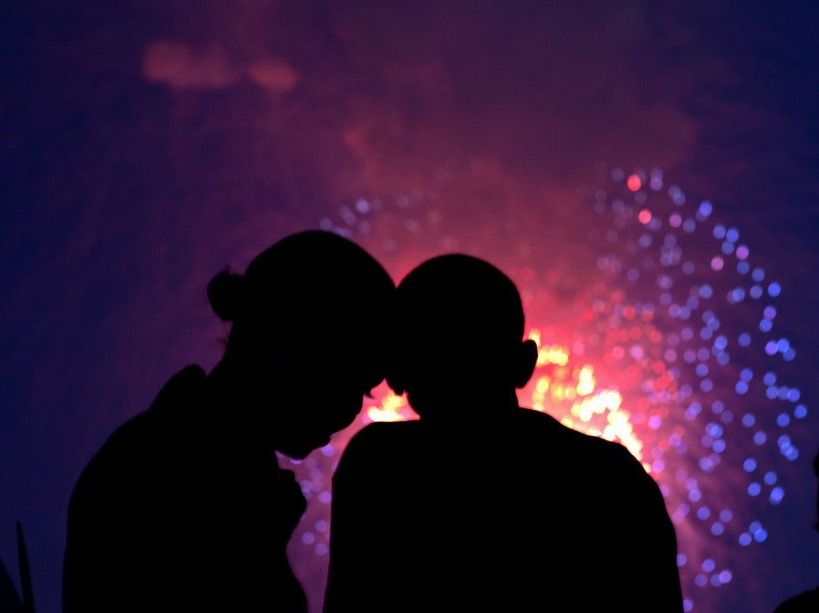 President Barack Obama and First Lady Michelle Obama watch the fireworks over the National Mall from the roof of the White House, July 4, 2010. (Official White House Photo by Pete Souza) This official White House photograph is being made available only for publication by news organizations and/or for personal use printing by the subject(s) of the photograph. The photograph may not be manipulated in any way and may not be used in commercial or political materials, advertisements, emails, products, promotions that in any way suggests approval or endorsement of the President, the First Family, or the White House.