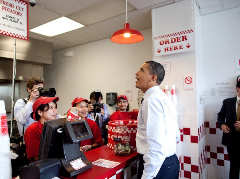 President Obama orders lunch at Five Guys in Washington, D.C. during an unannounced lunch outing May 29, 2009. (Official White House Photo by Pete Souza) This official White House photograph is being made available for publication by news organizations and/or for personal use printing by the subject(s) of the photograph. The photograph may not be manipulated in any way or used in materials, advertisements, products, or promotions that in any way suggest approval or endorsement of the President, the First Family, or the White House.