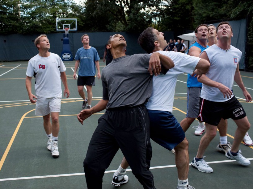 President Barack Obama, along with Cabinet Secretaries and Members of Congress, watch a shot during a basketball game on the White House court, Oct. 8, 2009. (Official White House Photo by Pete Souza) This official White House photograph is being made available only for publication by news organizations and/or for personal use printing by the subject(s) of the photograph. The photograph may not be manipulated in any way and may not be used in commercial or political materials, advertisements, emails, products, promotions that in any way suggests approval or endorsement of the President, the First Family, or the White House.